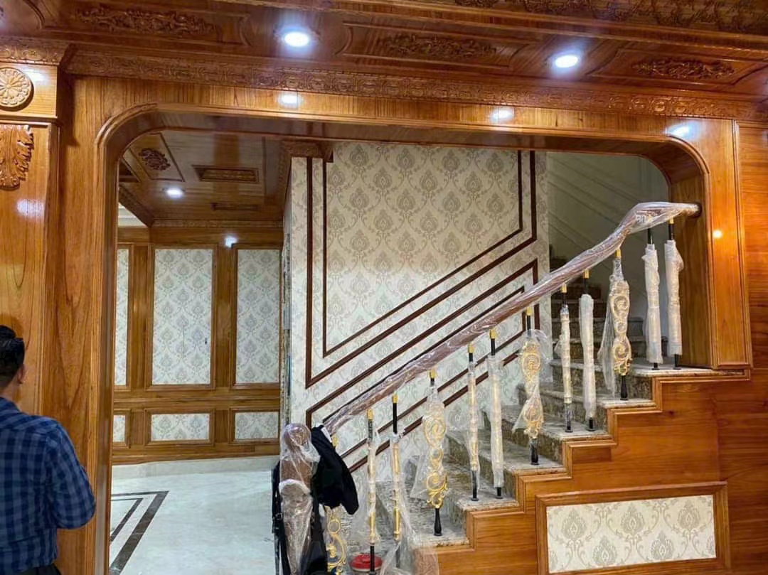 Giấy dán tường màu cam cho phòng khách và phòng ngủ thi công tại TPHCM